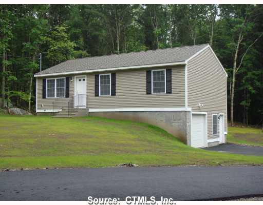 301 Quinebaug Road North Grosvenordale, CT 06255 - Photo 1 of 1 a front view of a house with garden