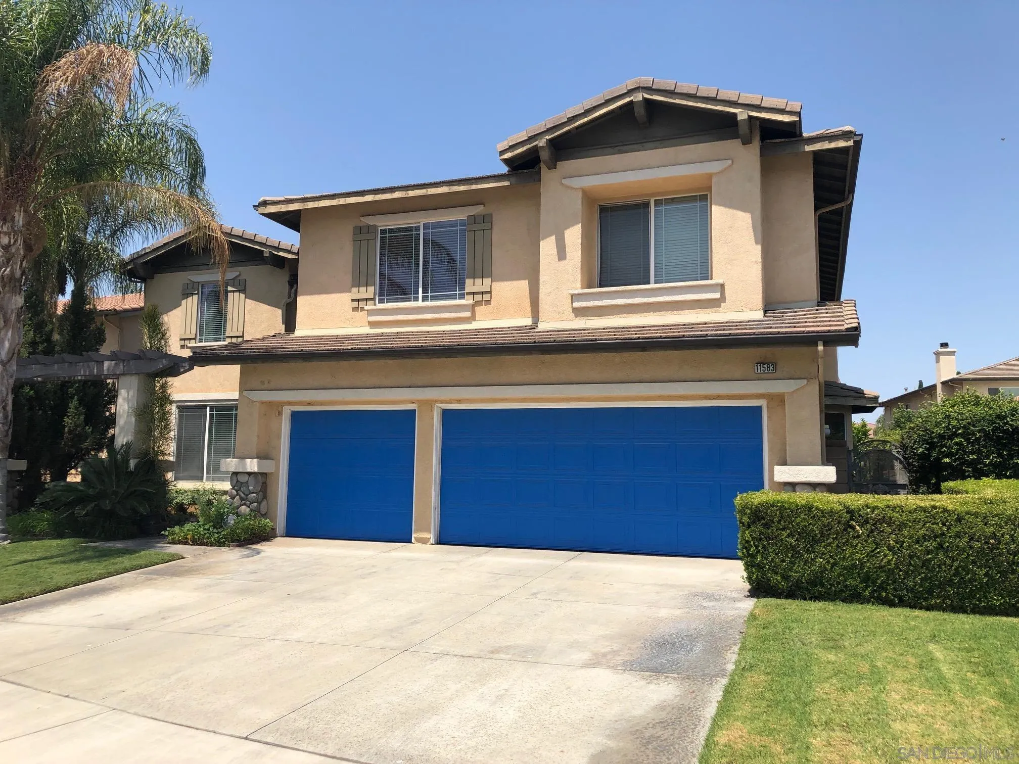 11583 Waterwell Court Riverside, CA 92505 - Photo 1 of 9 a view of a house with a yard and garage