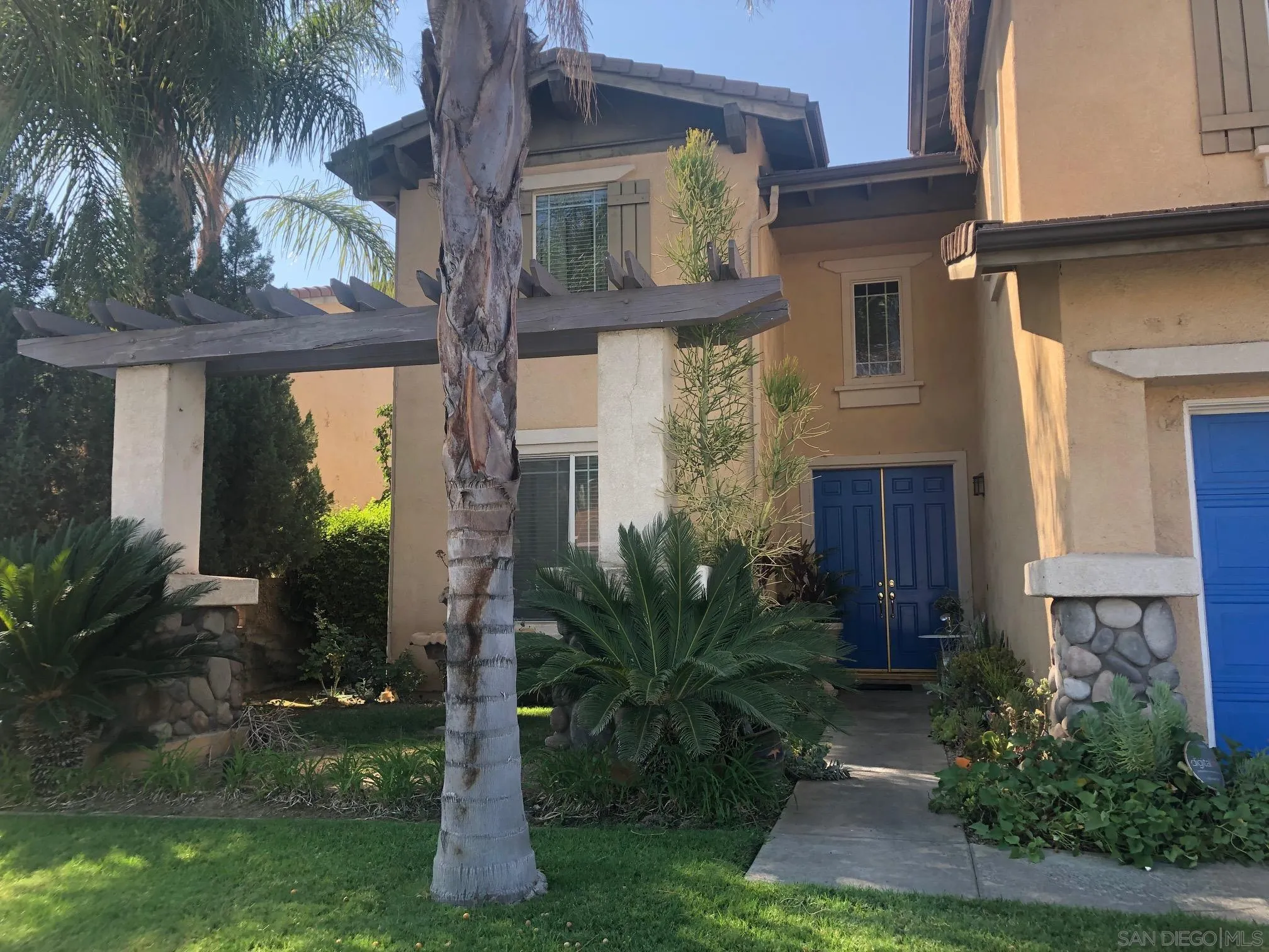 11583 Waterwell Court Riverside, CA 92505 - Photo 3 of 9 a front view of a house with garden