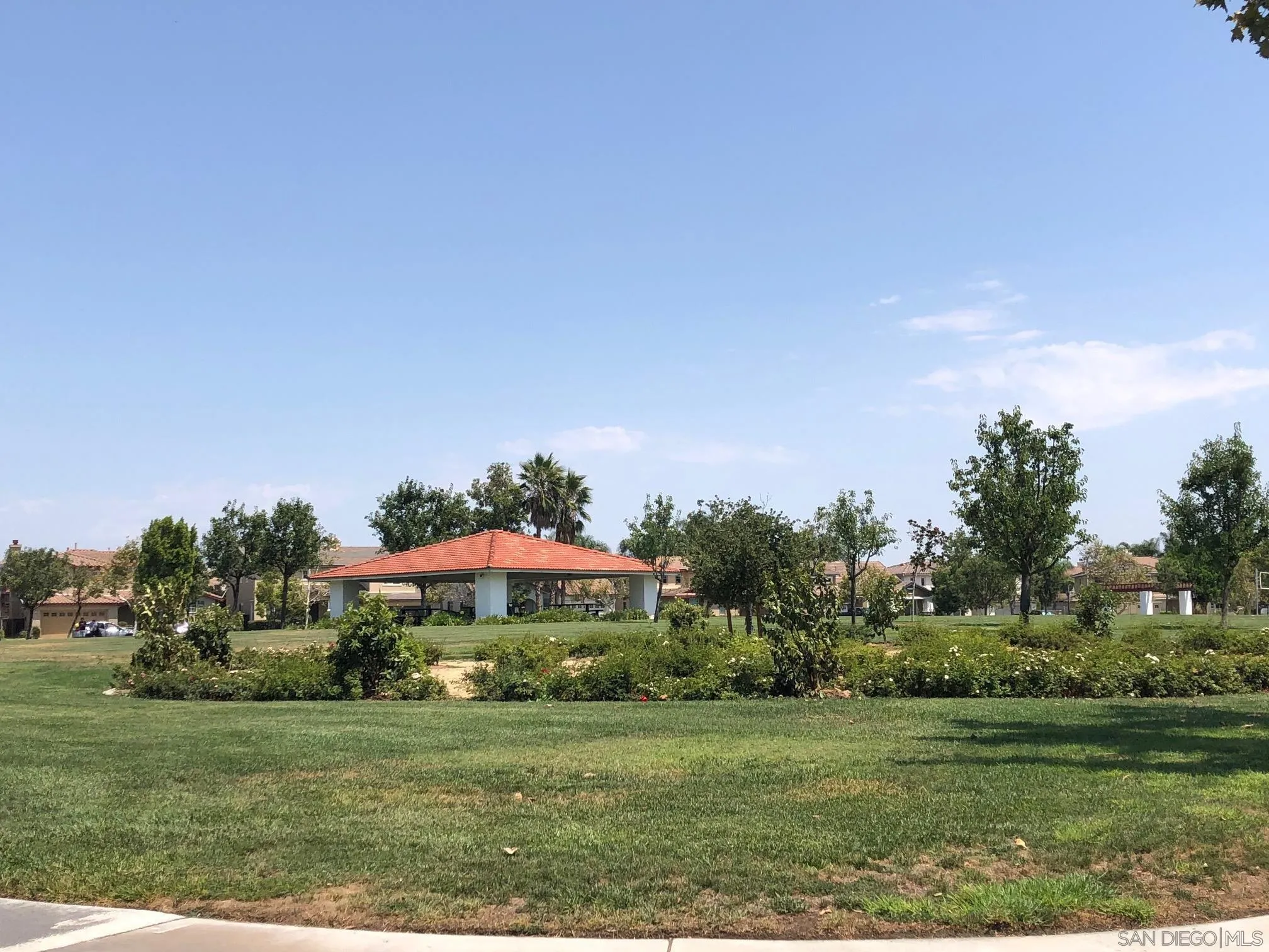 11583 Waterwell Court Riverside, CA 92505 - Photo 6 of 9 a view of a grassy field with an trees
