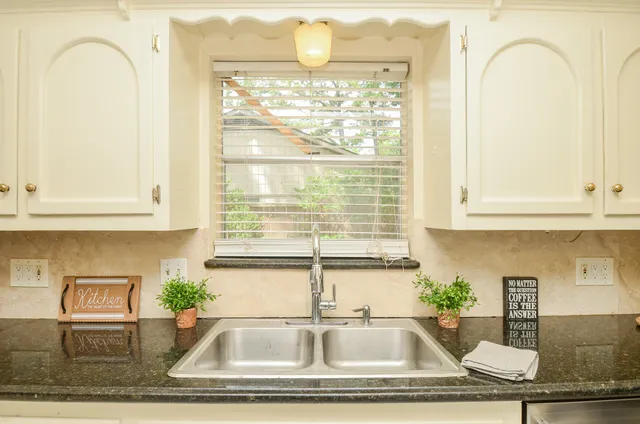 a kitchen with stainless steel appliances a refrigerator and cabinets