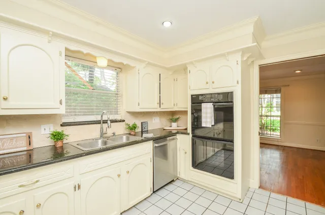 wooden floor fireplace and windows in an empty room