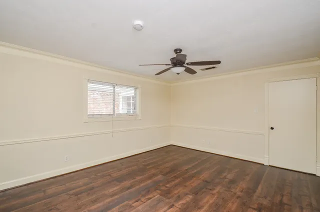 a view of a patio with table and chairs and wooden fence