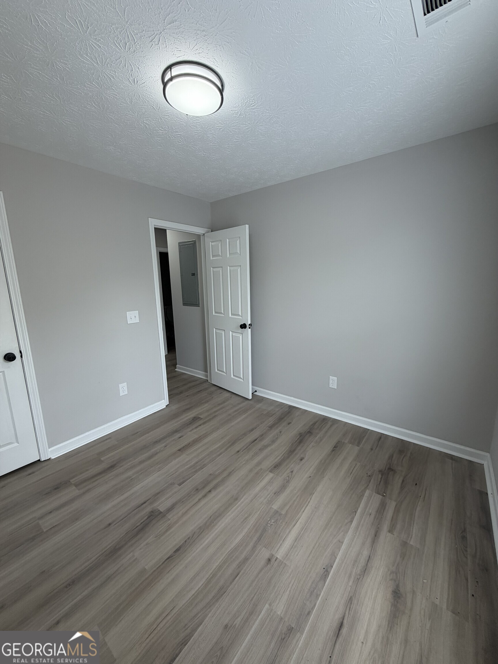 5773 Marlette Court Columbus, GA 31907 - Photo 13 of 21 a view of an empty room with wooden floor
