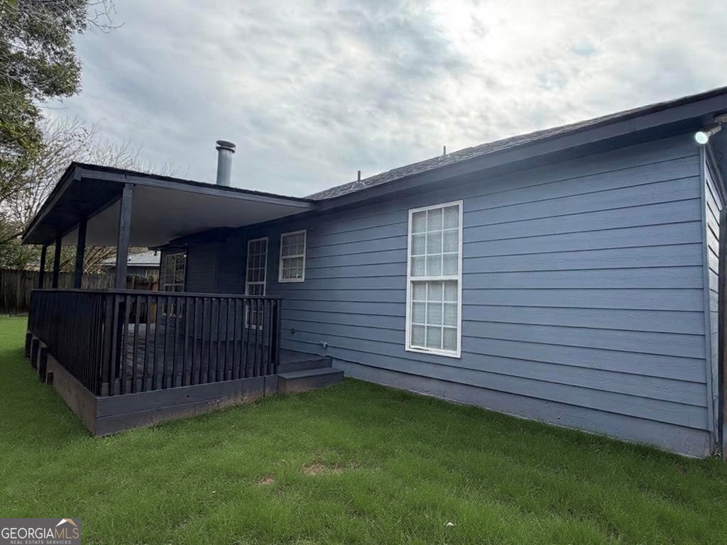 5773 Marlette Court Columbus, GA 31907 - Photo 18 of 21 a view of a wooden house with a yard