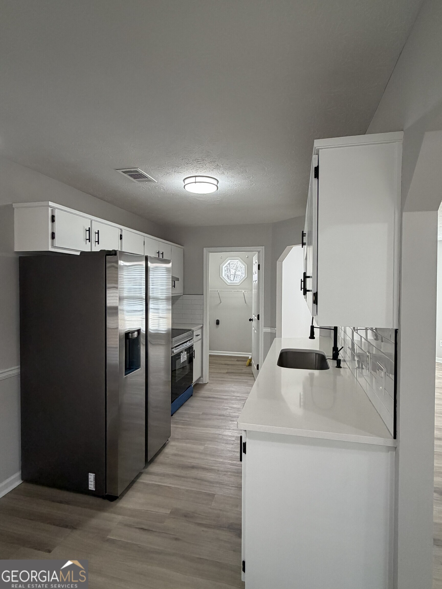 5773 Marlette Court Columbus, GA 31907 - Photo 5 of 21 a kitchen with stainless steel appliances a refrigerator and a stove