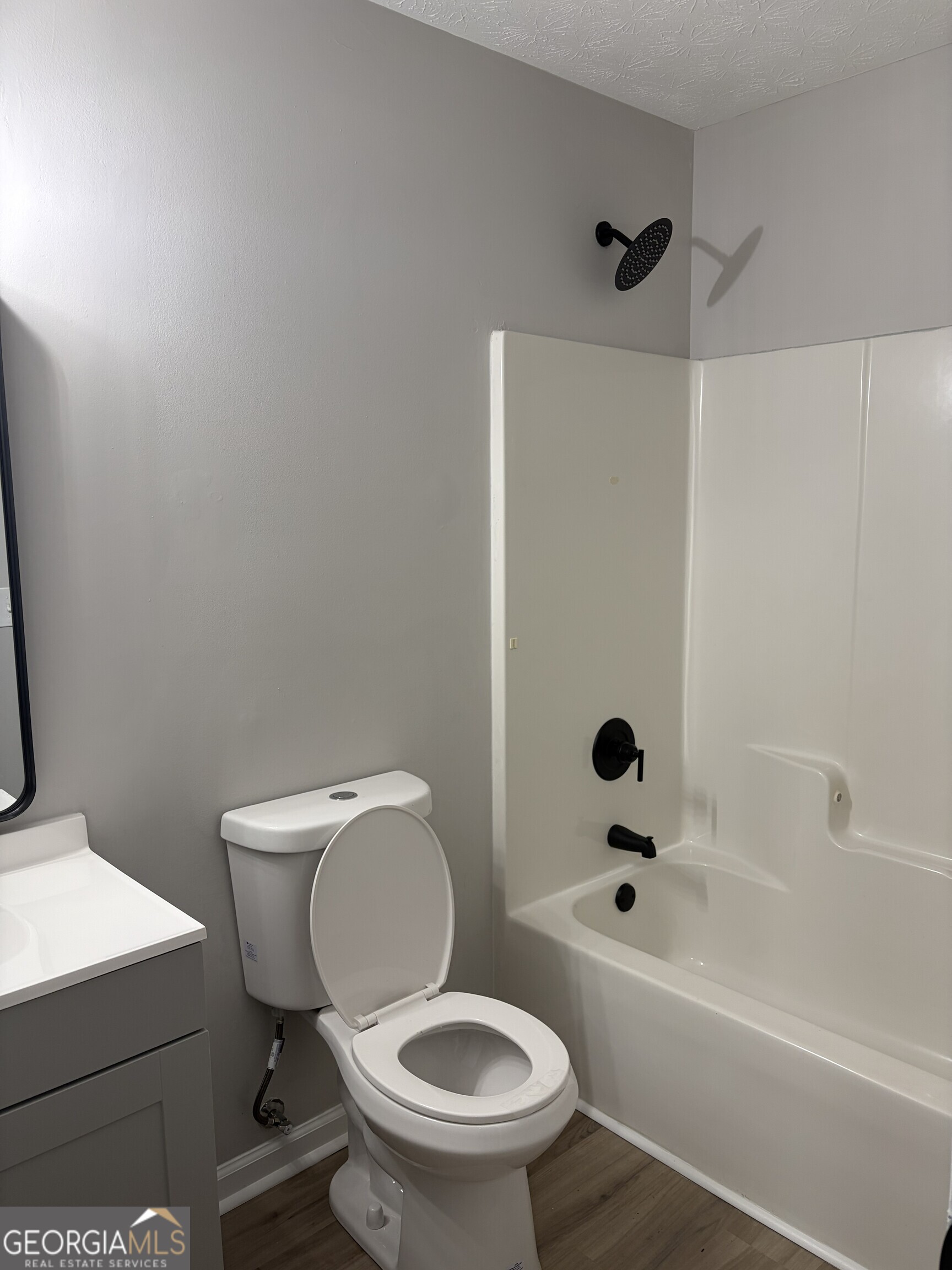 5773 Marlette Court Columbus, GA 31907 - Photo 9 of 21 a white toilet sitting next to a bath tub