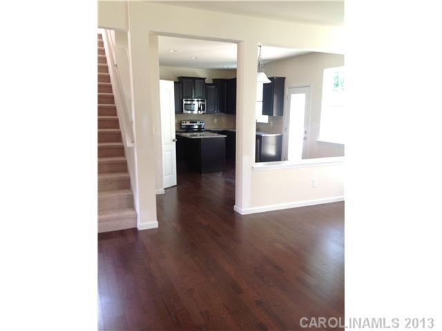 78110 Rillstone Drive Lancaster, SC 29720 - Photo 5 of 10 a view of a hallway with wooden floor