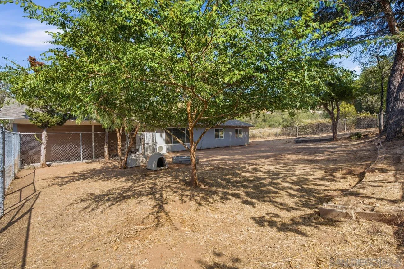 15773 Oak Valley Road Ramona, CA 92065 - Photo 30 of 42 Front yard fenced and shady with trees.