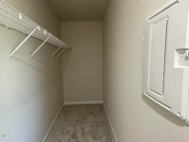 a view of a room with racks on the wall