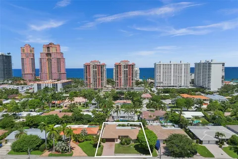 a view of a house with swimming pool and porch with furniture