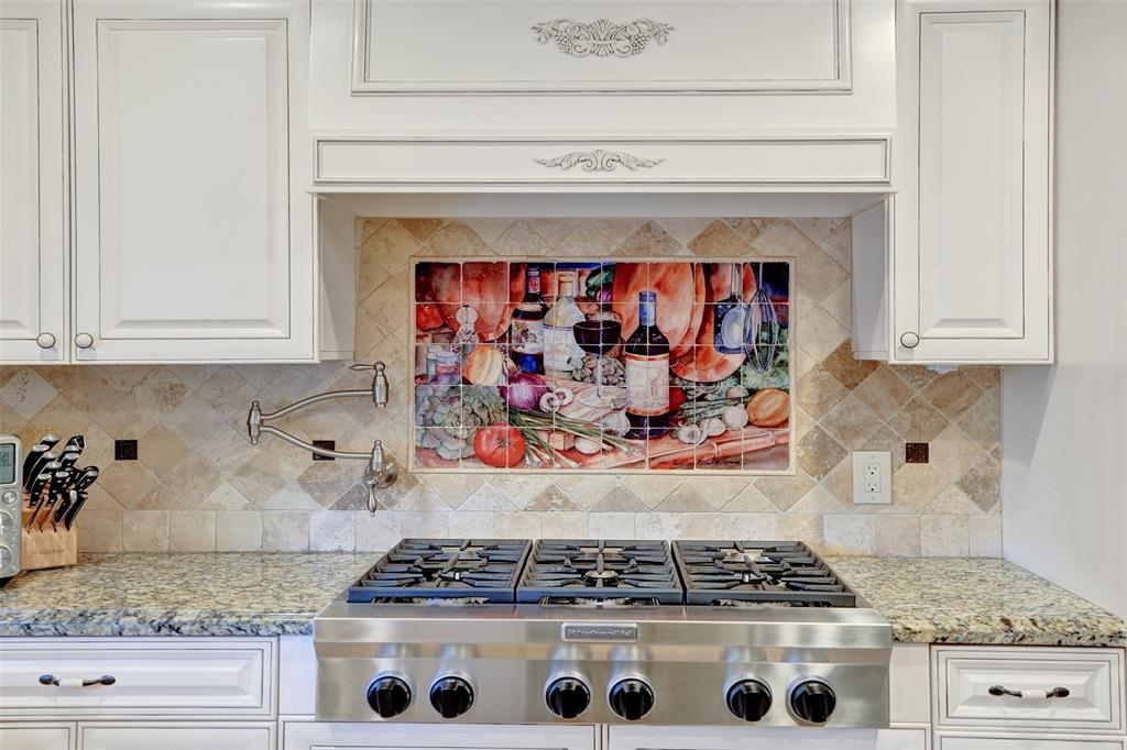 2000 Northeast 31st Avenue Fort Lauderdale, FL 33305 - Photo 19 of 47 a kitchen with stainless steel appliances granite countertop a stove and white cabinets