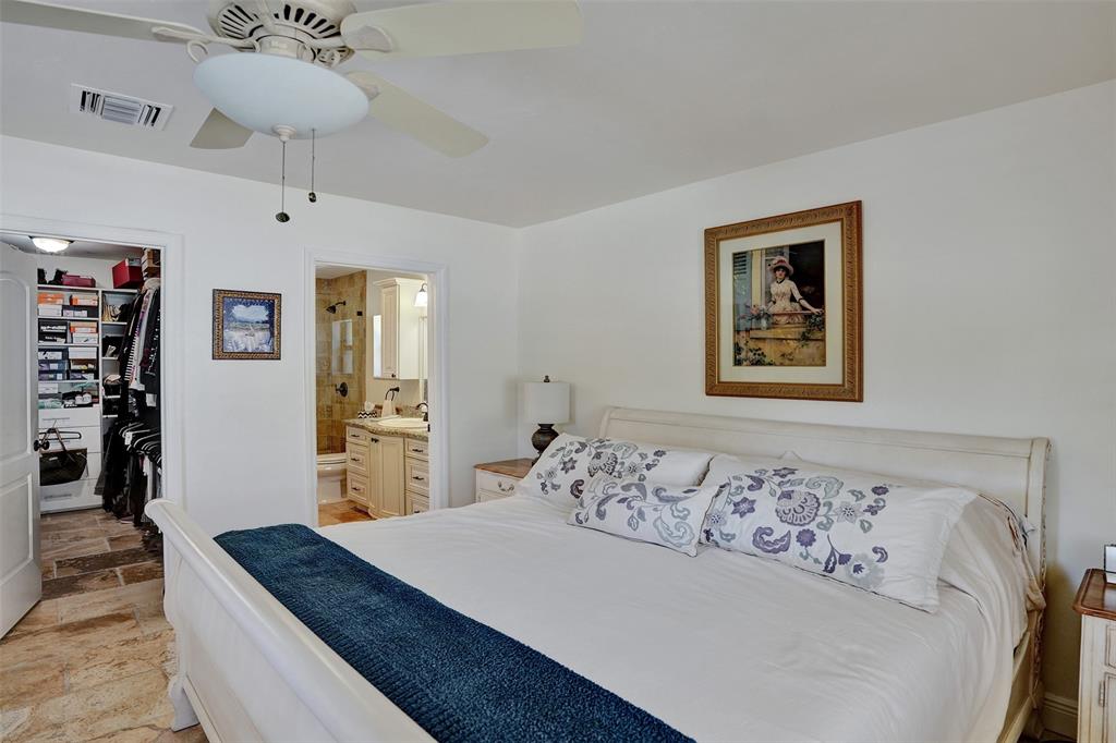 2000 Northeast 31st Avenue Fort Lauderdale, FL 33305 - Photo 22 of 47 a bed room with a bed and a chandelier