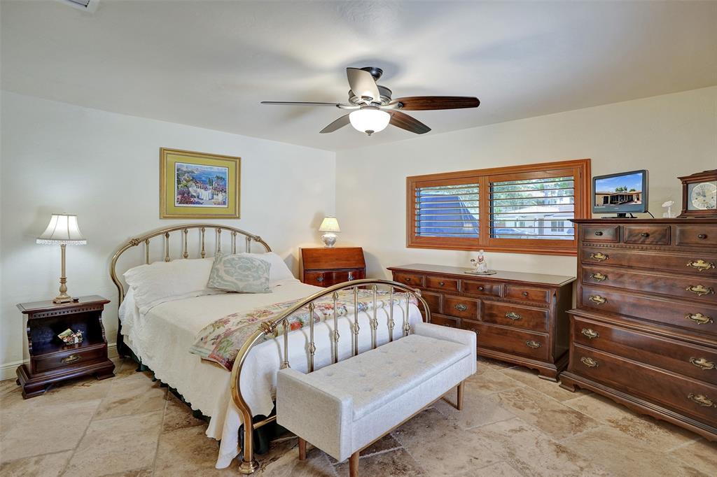 2000 Northeast 31st Avenue Fort Lauderdale, FL 33305 - Photo 27 of 47 a bedroom with a bed and a dresser