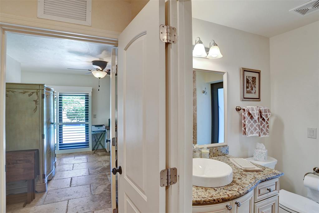 2000 Northeast 31st Avenue Fort Lauderdale, FL 33305 - Photo 30 of 47 a bathroom with a granite countertop sink mirror vanity and toilet