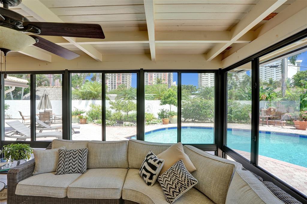 2000 Northeast 31st Avenue Fort Lauderdale, FL 33305 - Photo 39 of 47 a living room with furniture and floor to ceiling windows