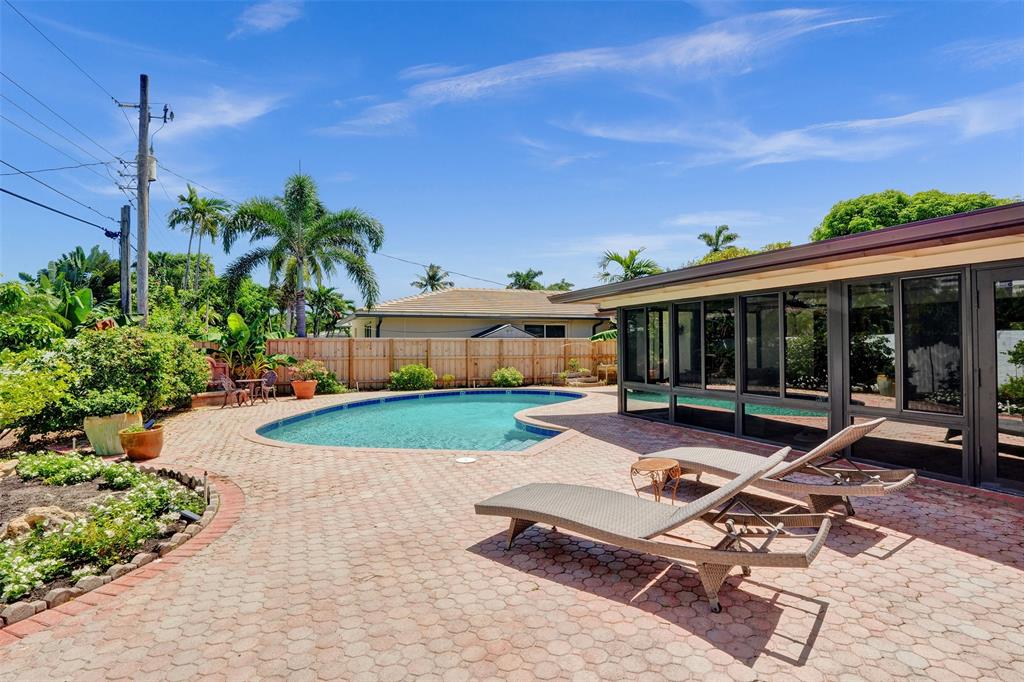 2000 Northeast 31st Avenue Fort Lauderdale, FL 33305 - Photo 42 of 47 a house view with a sitting space fire pit and outdoor space