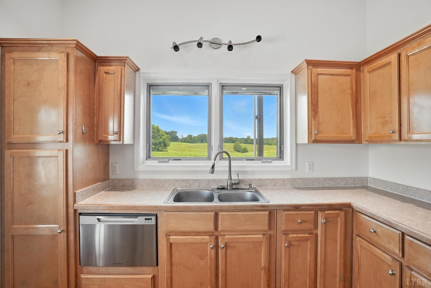 1433 Piney Mountain Road Appomattox, VA 24522 - Photo 21 of 68 a kitchen with stainless steel appliances granite countertop a refrigerator and a sink