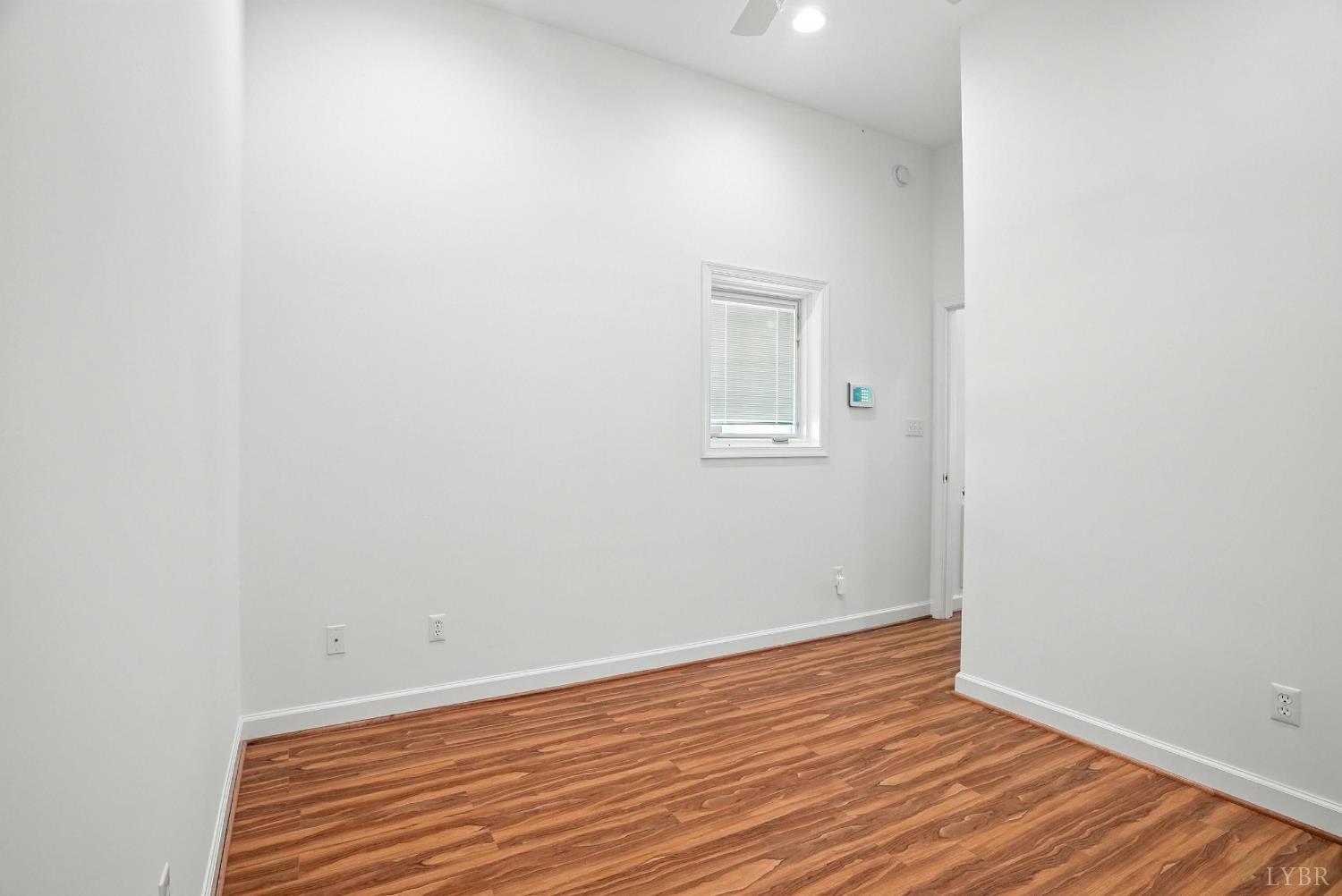 1433 Piney Mountain Road Appomattox, VA 24522 - Photo 25 of 68 a view of an empty room with wooden floor