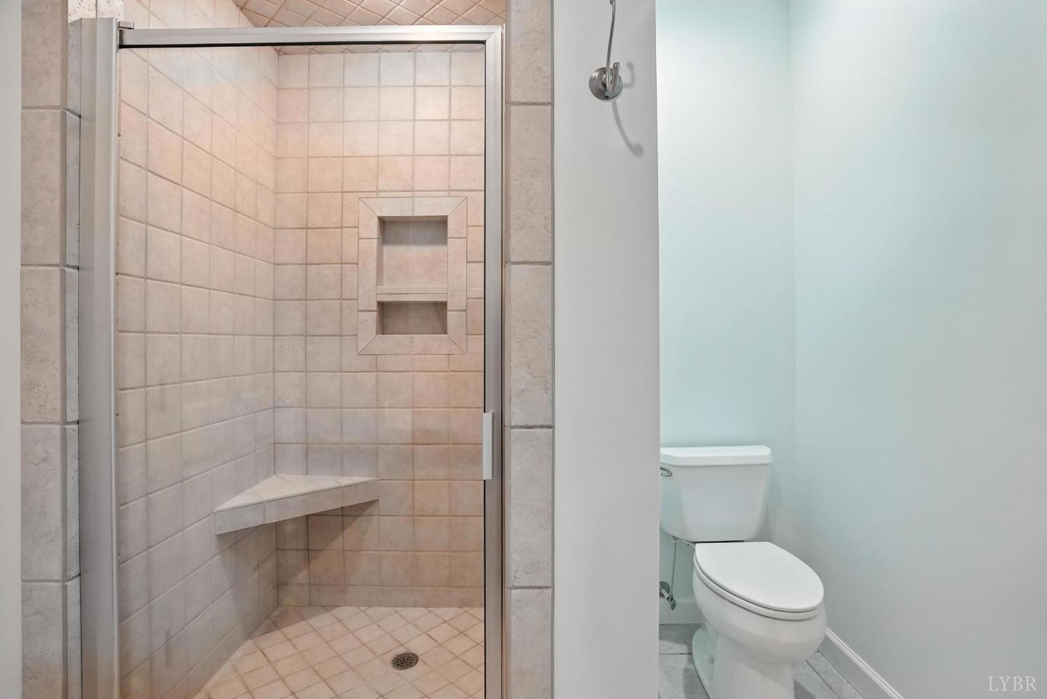 1433 Piney Mountain Road Appomattox, VA 24522 - Photo 27 of 68 a bathroom with a toilet and a shower