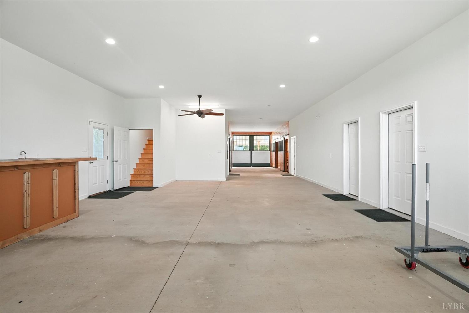 1433 Piney Mountain Road Appomattox, VA 24522 - Photo 28 of 68 an empty room with windows and pillars in it