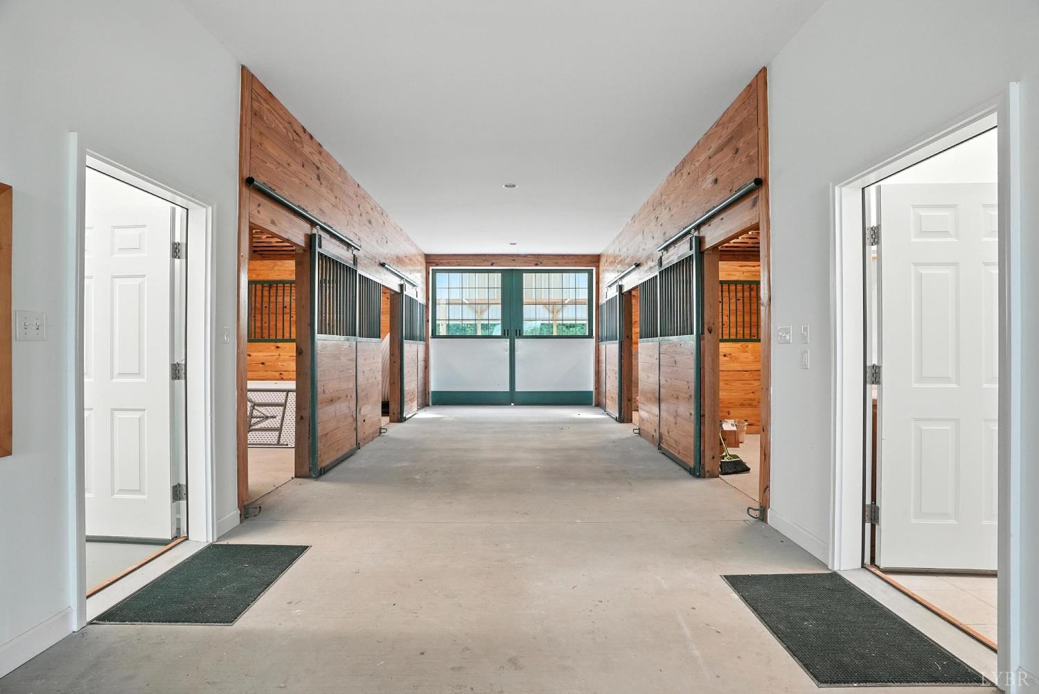 1433 Piney Mountain Road Appomattox, VA 24522 - Photo 30 of 68 a view of a hallway with wooden shelves and door