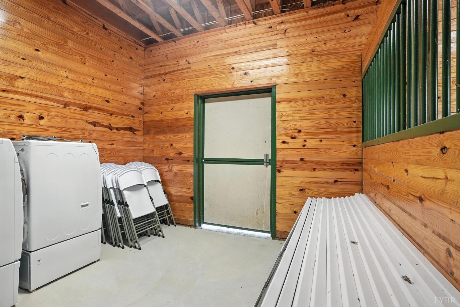 1433 Piney Mountain Road Appomattox, VA 24522 - Photo 34 of 68 a view of a balcony with chairs and white walls