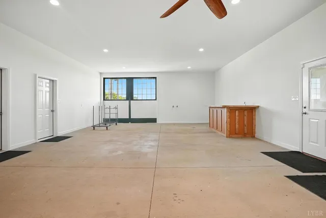 a bathroom with a granite countertop sink a toilet and bathtub