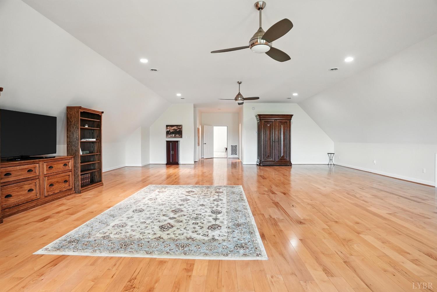 1433 Piney Mountain Road Appomattox, VA 24522 - Photo 38 of 68 a living room with furniture and a flat screen tv