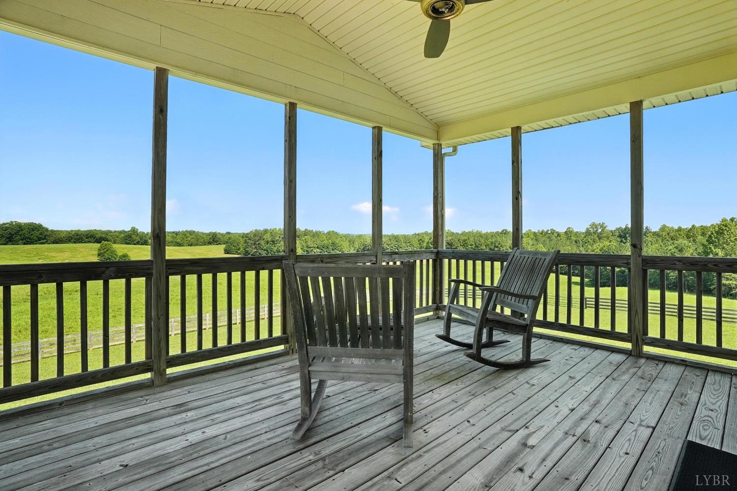 1433 Piney Mountain Road Appomattox, VA 24522 - Photo 40 of 68 a view of a balcony with wooden floor next to a iron stairs