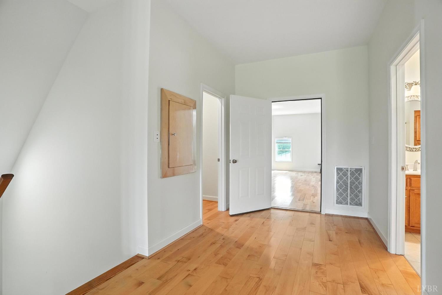 1433 Piney Mountain Road Appomattox, VA 24522 - Photo 41 of 68 a view of empty room with wooden floor and fan