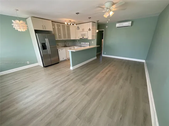 a view of a kitchen with a sink cabinets and window