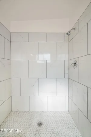 a view of a hallway with white walls