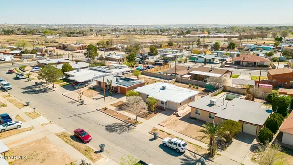 an aerial view of residential houses with outdoor space