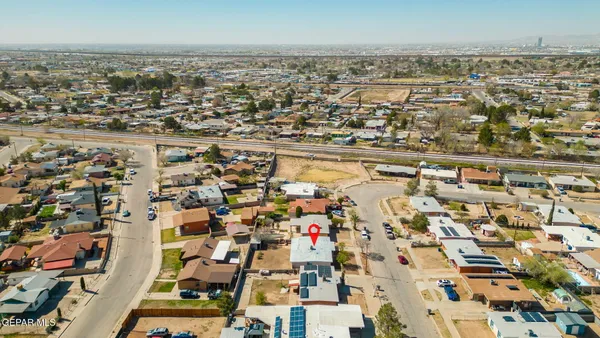 an aerial view of residential building with parking space