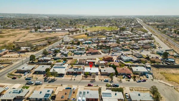 an aerial view of residential building and parking space