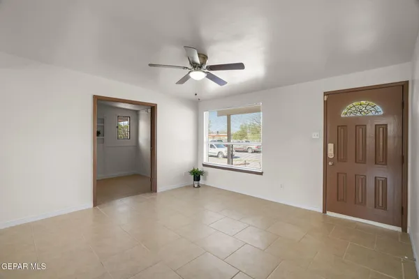 a view of an empty room with a window