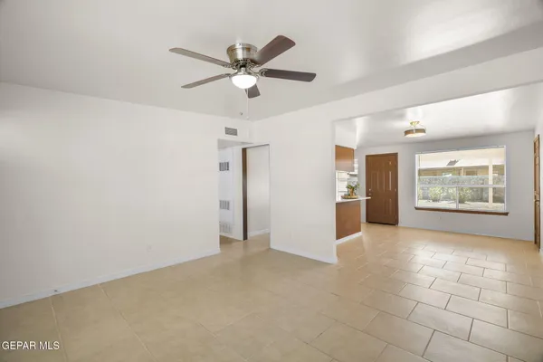 a view of an empty room with a window