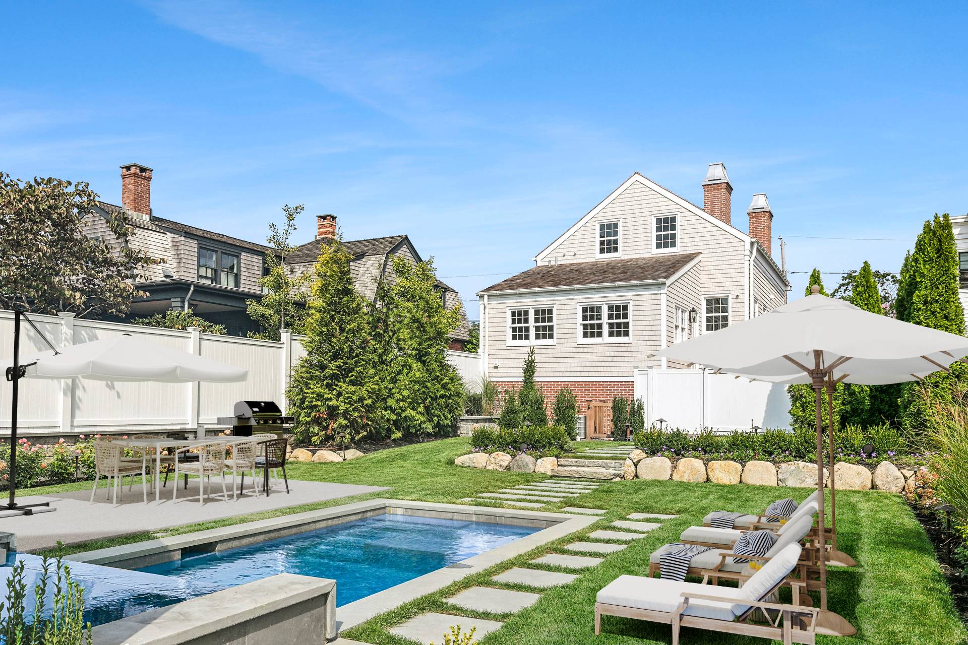 27 Howard Street Sag Harbor, NY 11963 - Photo 1 of 38 a front view of a house with garden