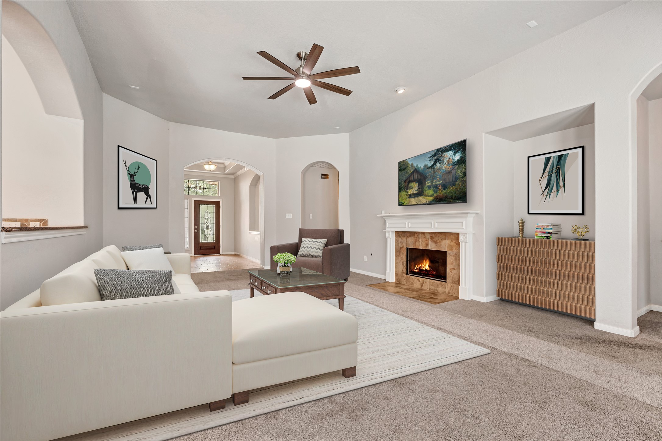 27 Planchard Court Spring, TX 77382 - Photo 4 of 16 a living room with furniture a fireplace and a flat screen tv