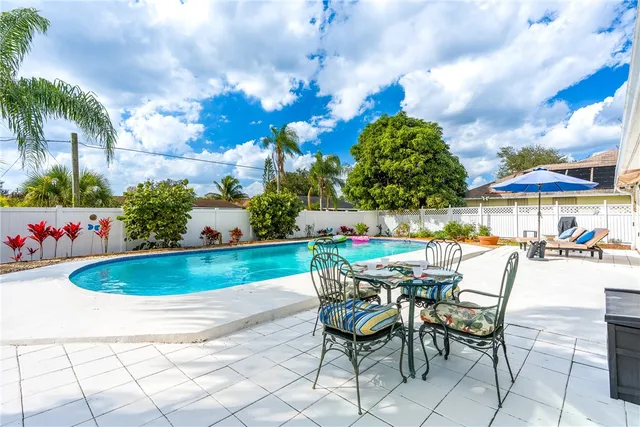 a view of an chairs and table in the patio