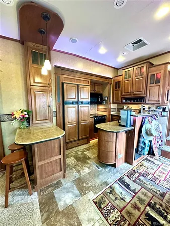 a white toilet sitting next to a bathroom sink and a mirror