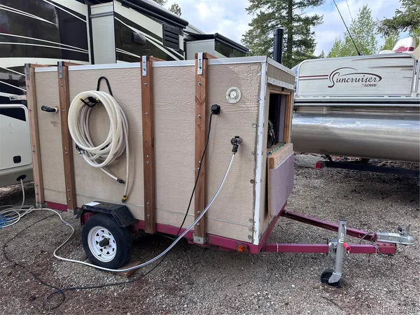 a view of living room with a sink and cabinets
