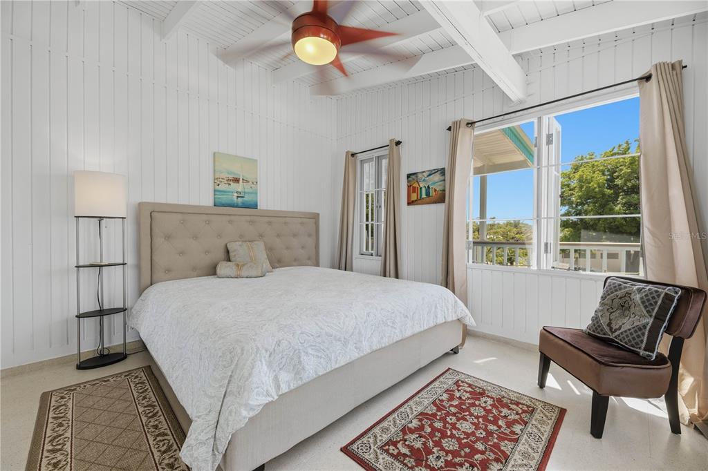 1 Gil Bouyet Street Cabo Rojo, PR 00623 - Photo 14 of 24 a bedroom with a bed chair and window
