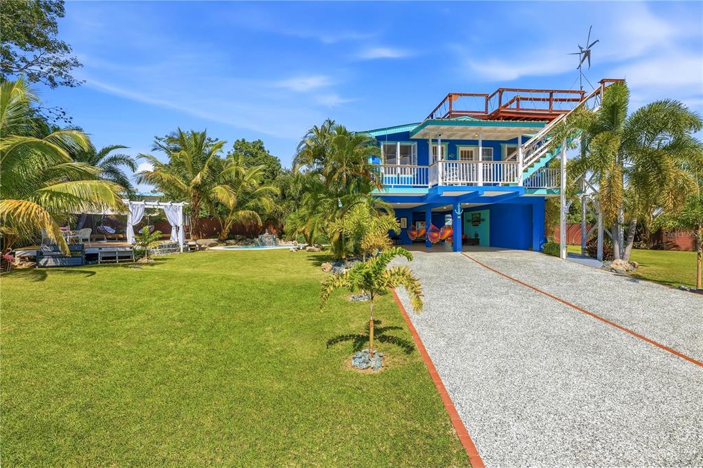 1 Gil Bouyet Street Cabo Rojo, PR 00623 - Photo 2 of 24 a view of a house with a swimming pool