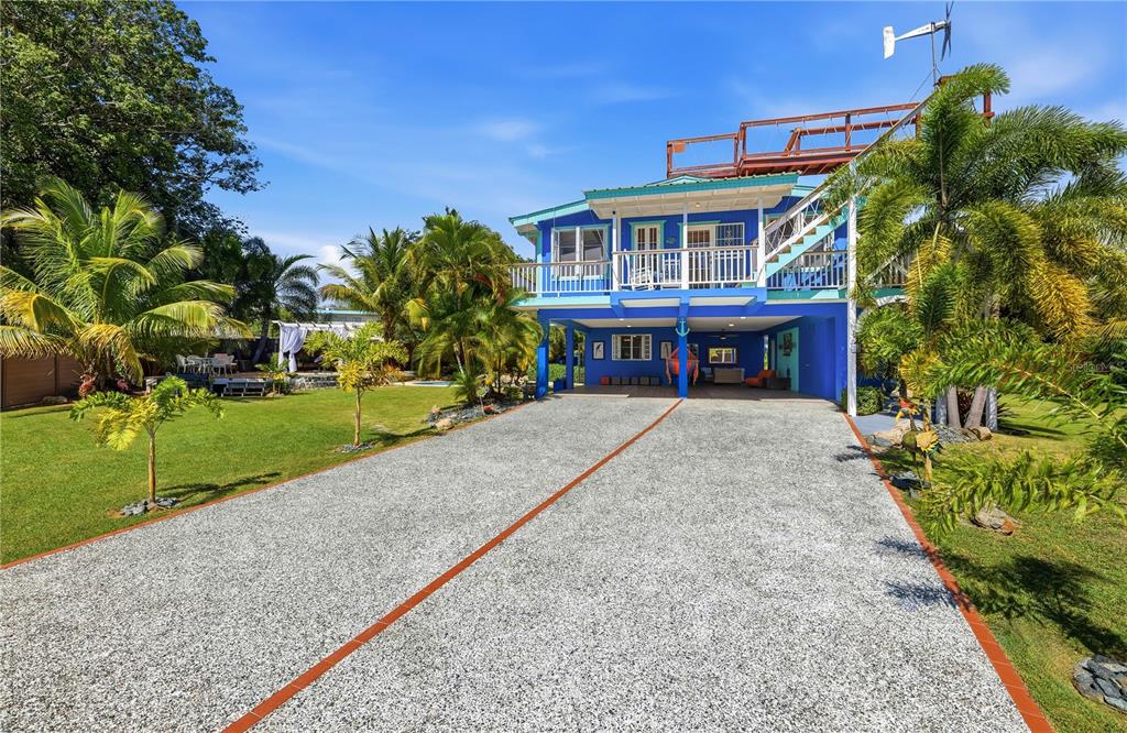 1 Gil Bouyet Street Cabo Rojo, PR 00623 - Photo 21 of 24 front view of a house with a yard