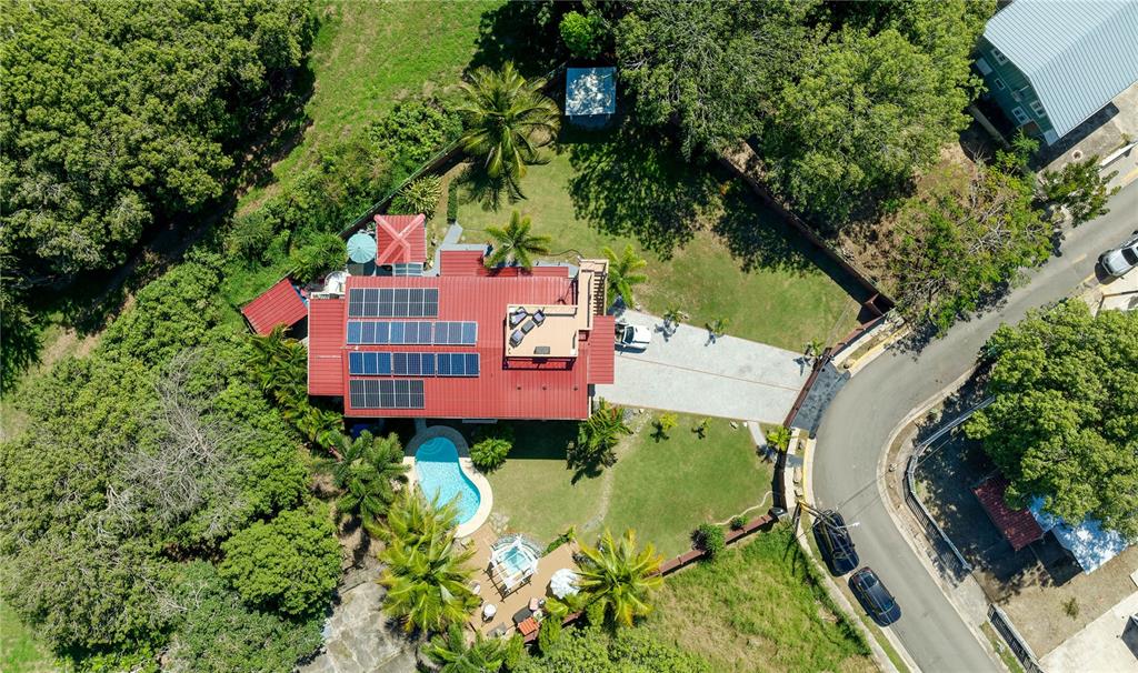 1 Gil Bouyet Street Cabo Rojo, PR 00623 - Photo 22 of 24 an aerial view of a house with swimming pool and garden
