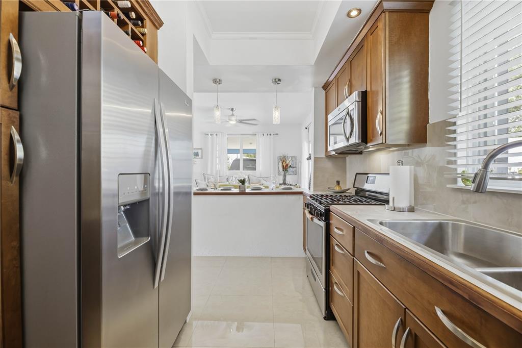 1 Gil Bouyet Street Cabo Rojo, PR 00623 - Photo 6 of 24 a kitchen with white cabinets and stainless steel appliances