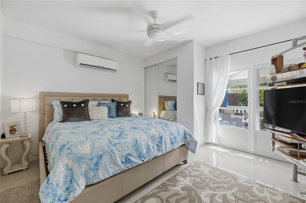 1 Gil Bouyet Street Cabo Rojo, PR 00623 - Photo 7 of 24 a bedroom with a bed and a flat tv screen on the dresser
