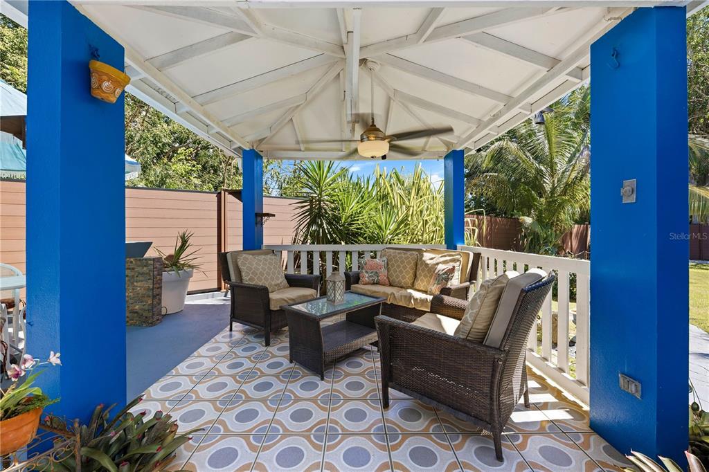 1 Gil Bouyet Street Cabo Rojo, PR 00623 - Photo 8 of 24 a outdoor living room with furniture and a floor to ceiling window